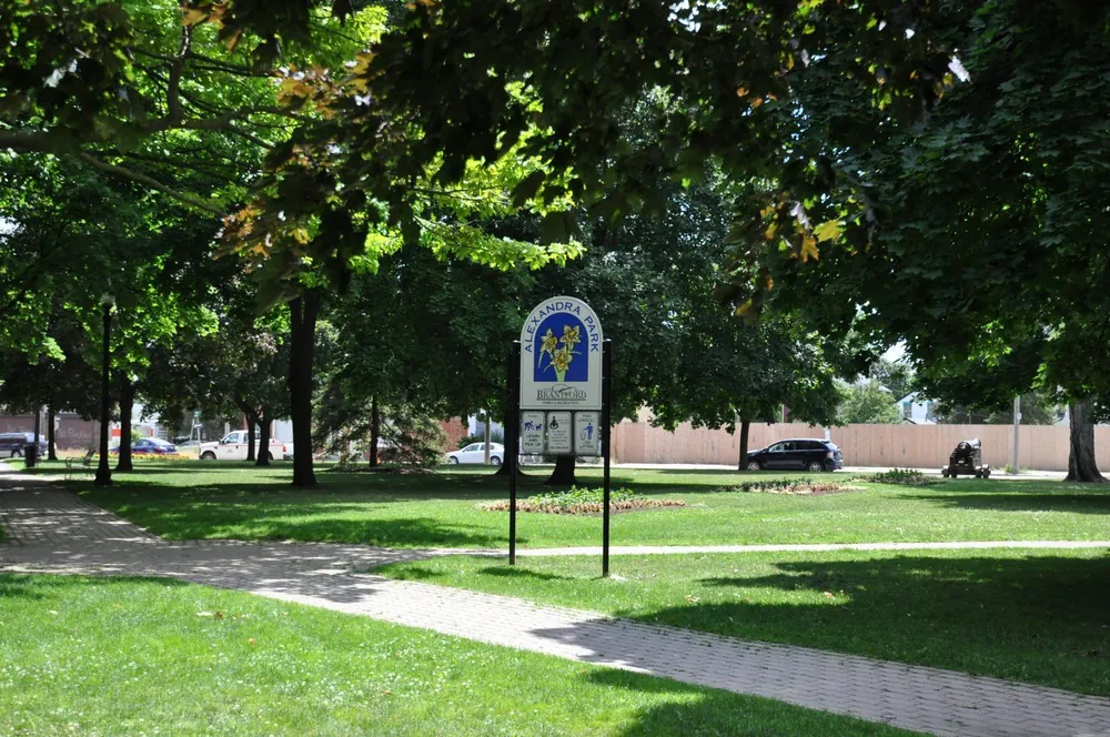 Alexandra Park sign and tree-lined paths, directly across Dalhousie Street from Parkview